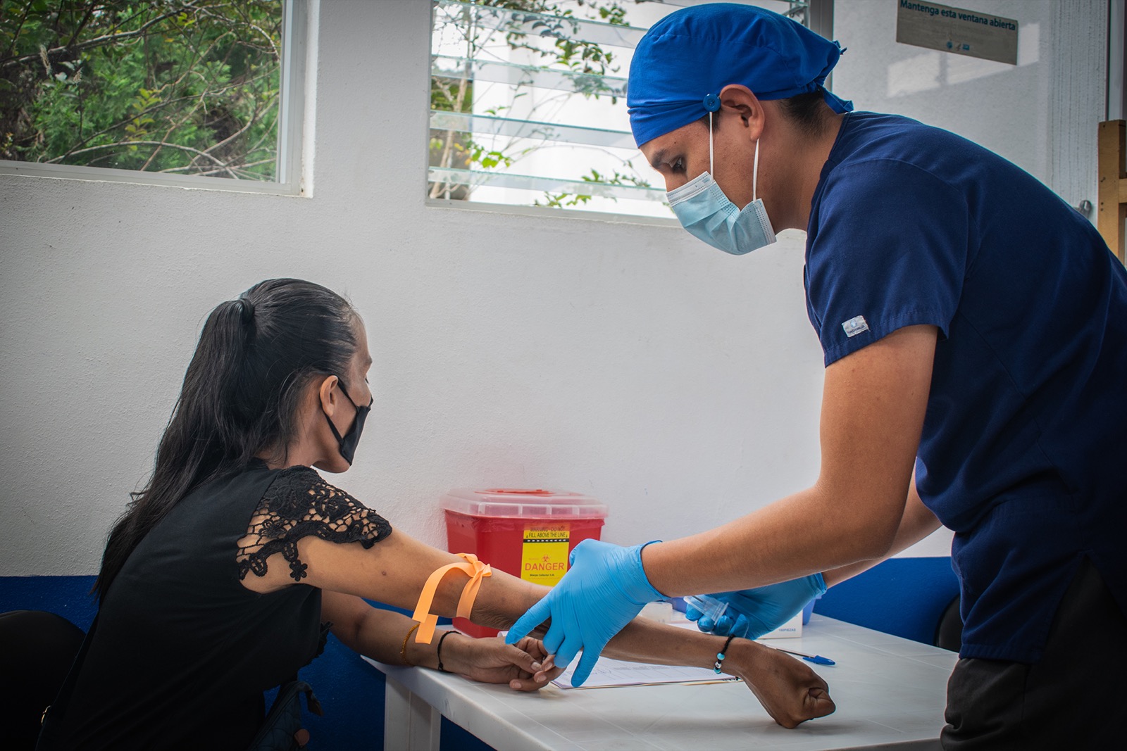 Viral load sample collection in a facility setting